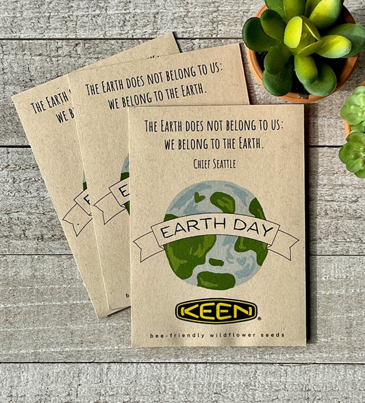 Three brown seed packets with an illustration of the earth and the words, Earth Day.