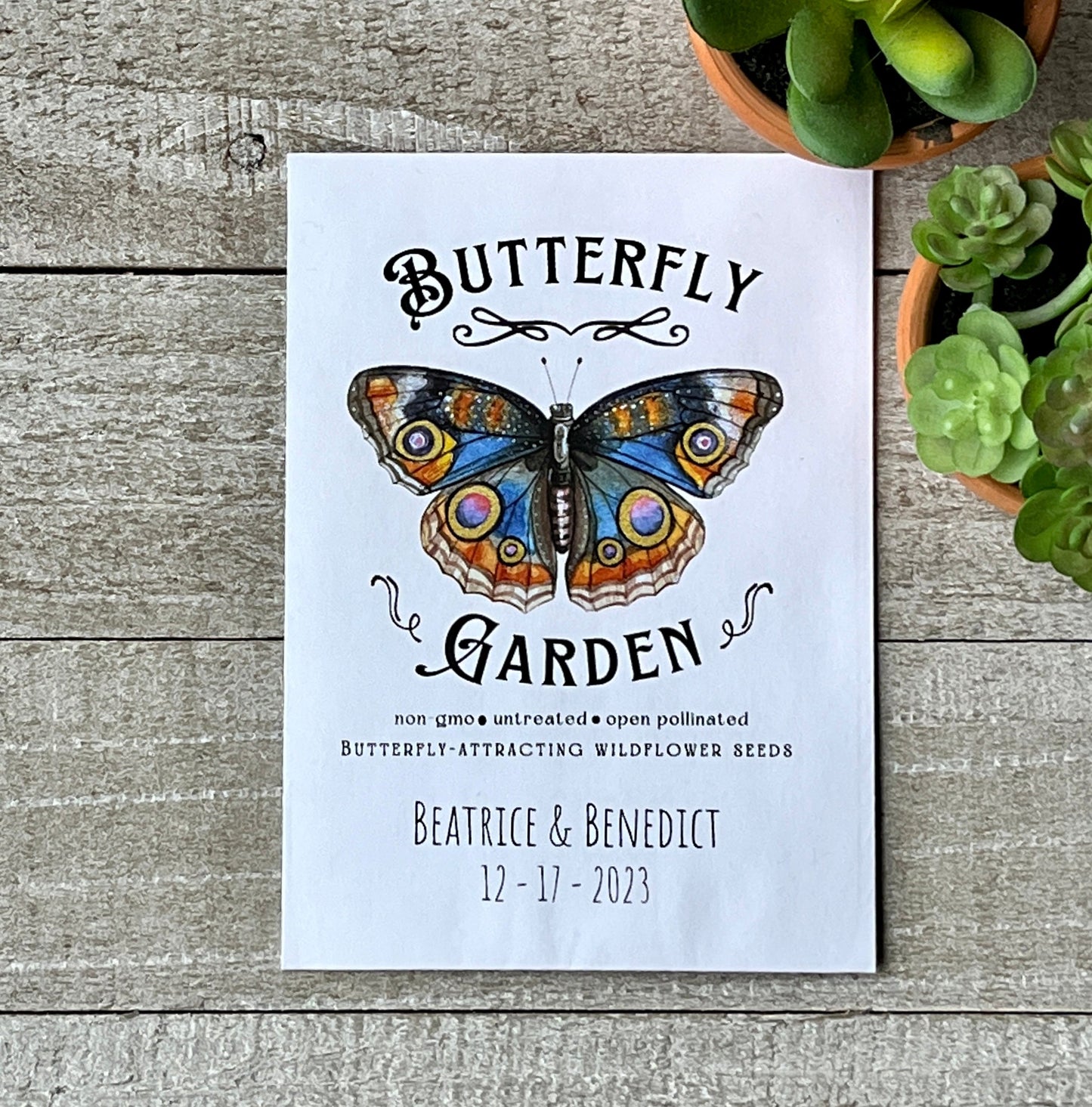 A white seed packet with a full color illustration of a butterfly and the words Butterfly Garden.