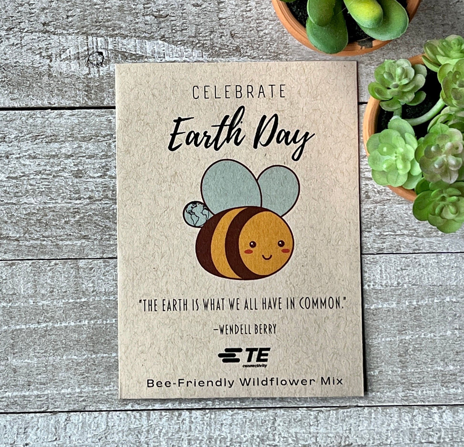 A brown seed packet with a large, cartoon bee and the words, "Happy Earth Day.