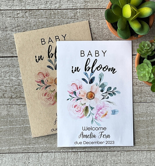 Two packets, one white and one brown, with pink flowers and the words Baby In Bloom.